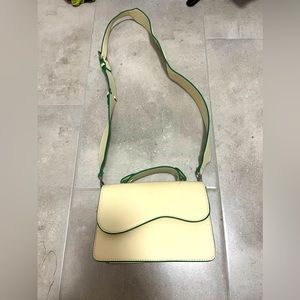 Small crossbody bag with asymmetrical flap from HVISK